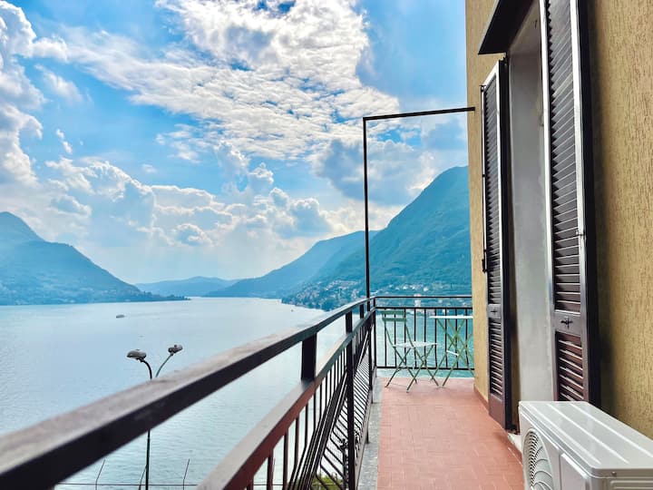 Balcony with shutters and lake panorama
