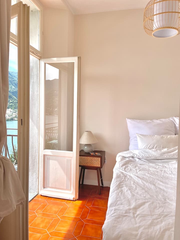 Bedroom with terracotta hex-tiled floor