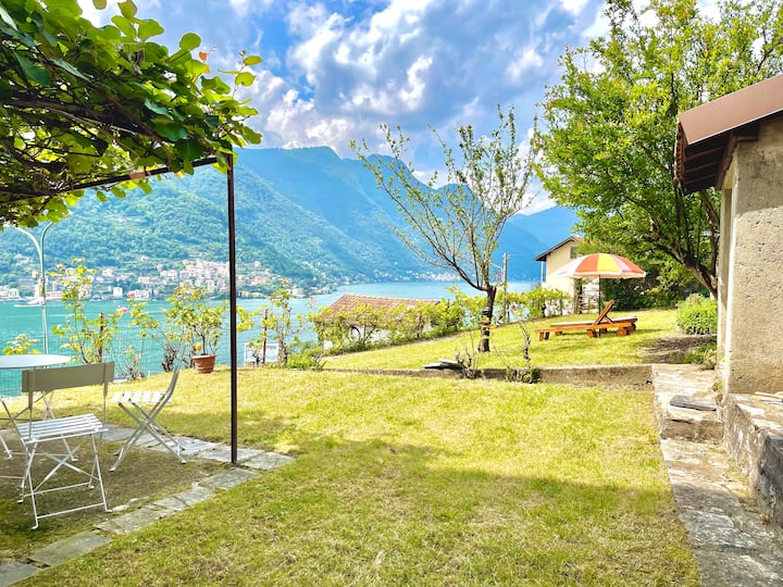 Private garden above Lake Como with loungers and pergola