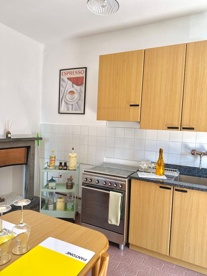 Kitchen with espresso poster and fireplace